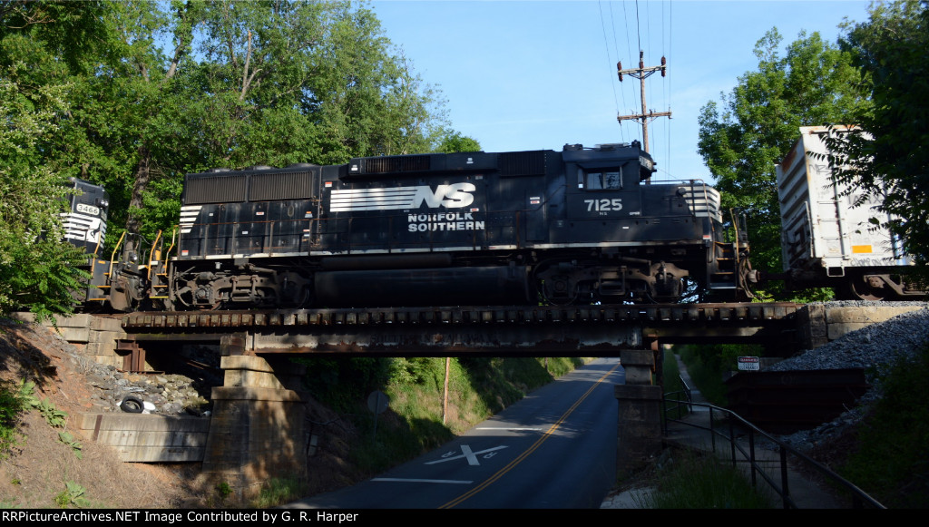 Trailing unit of NS yard jab E23 crosses Campbell Avenue on the Old Main Line.